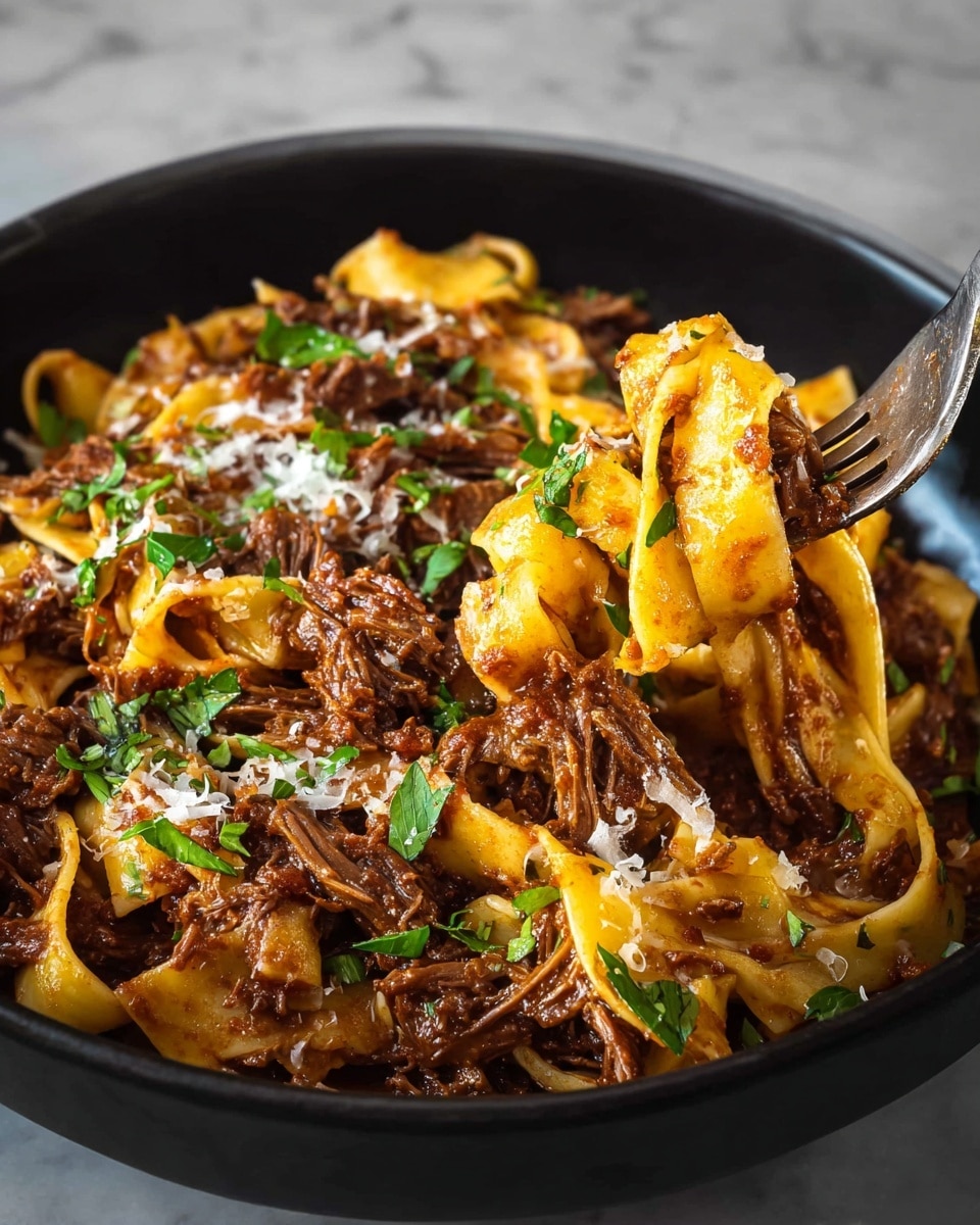The image shows a black bowl filled with rich beef ragout pasta. The dish has two main layers: thick flat yellow pasta ribbons twisted softly, and tender, chunky dark brown shredded beef mixed throughout. Fresh green parsley leaves are scattered on top, adding a bright touch. Small bits of grated white cheese are sprinkled around, slightly melting into the warm dish. A fork is twisting a portion of pasta and beef in the bowl, lifting it up from the right side. The background is a white marbled texture. photo taken with an iphone --ar 4:5 --v 7